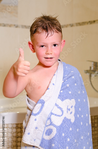Photo: Little boy in the bathroom giving a thumbs up Little boy in the bathroom giving a thumbs up