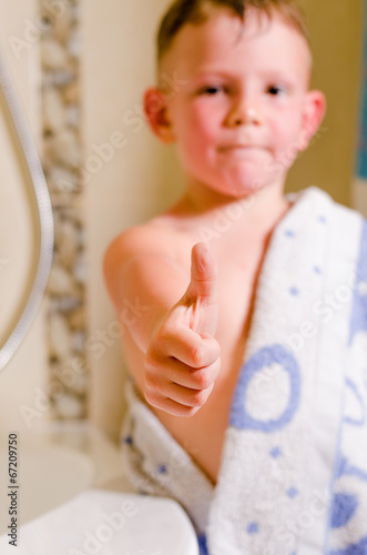 Photo: Little boy in the bathroom giving a thumbs up Little boy in the bathroom giving a thumbs up