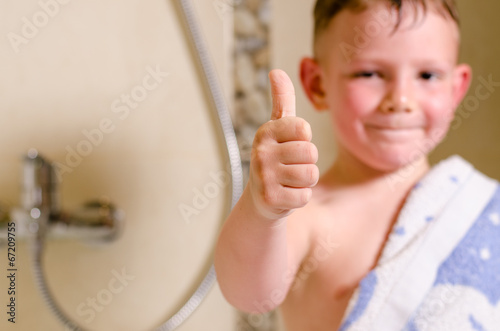 Photo: Little boy in the bathroom giving a thumbs up Little boy in the bathroom giving a thumbs up