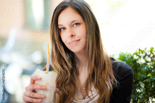 Photo: Beautiful woman having a drink Beautiful woman having a drink