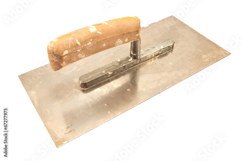Photo: Used finishing trowel isolated on white Used finishing trowel isolated on white