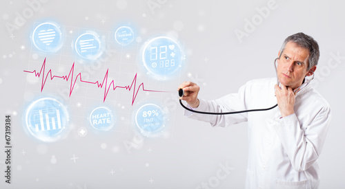 Photo: Doctor examinating modern heartbeat graphics Doctor examinating modern heartbeat graphics