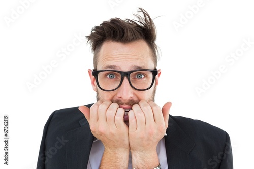 Photo: Geeky nervous businessman looking at camera Geeky nervous businessman looking at camera