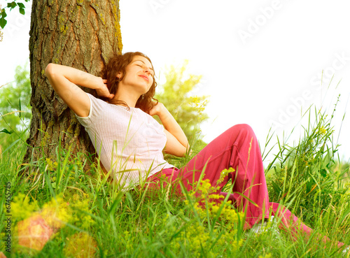 Photo: Beautiful Young Woman Outdoors Enjoying Nature Beautiful Young Woman Outdoors Enjoying Nature