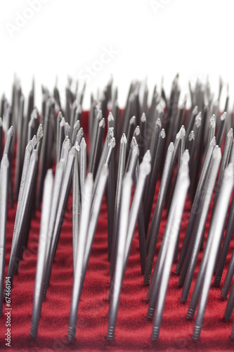 Photo: Bunch of nails on a white background - Isolated on white. Bunch of nails on a white background - Isolated on white.