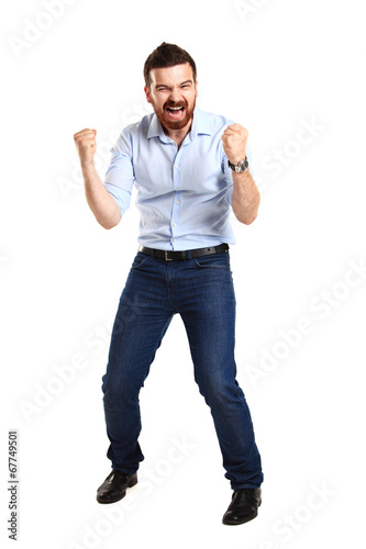 Photo: Excited handsome man with arms raised in success - Excited handsome man with arms raised in success -