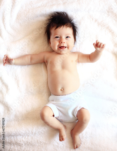 Photo: Beautiful expressive adorable happy cute laughing smiling baby Beautiful expressive adorable happy cute laughing smiling baby