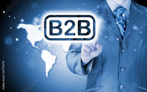 Photo: businessman pointing to word B2B businessman pointing to word B2B