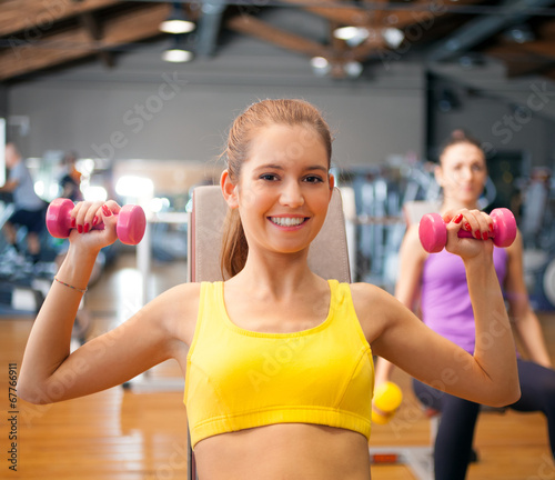 Photo: Active woman working out in a gym Active woman working out in a gym