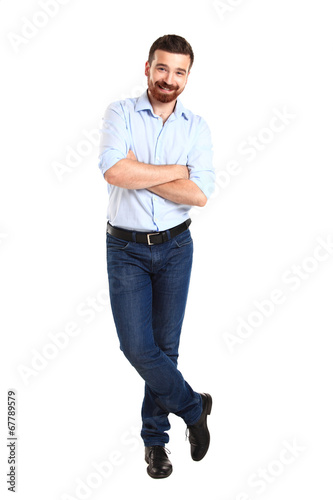 Photo: Handsome casual man smiling - isolated over a white background Handsome casual man smiling - isolated over a white background