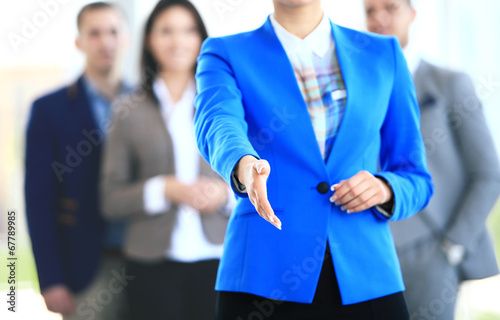 Photo: woman with an open hand ready to seal a deal woman with an open hand ready to seal a deal