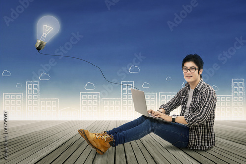 Photo: Smart student studying with laptop Smart student studying with laptop