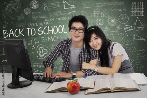 Photo: Young couple in class Young couple in class
