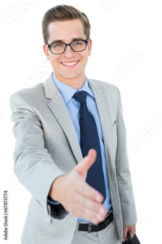 Photo: Geeky businessman offering his hand Geeky businessman offering his hand