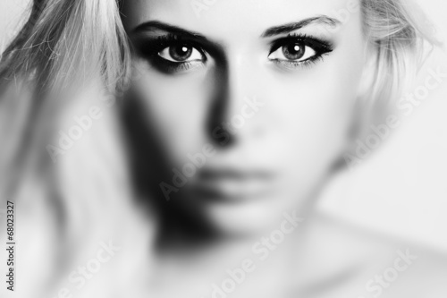 Photo: Beautiful Eyes of Young Woman.Blond girl.Art monochrome.effect Beautiful Eyes of Young Woman.Blond girl.Art monochrome.effect