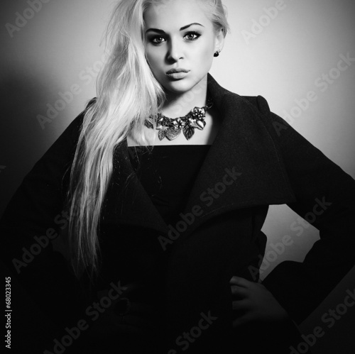 Photo: Beautiful Blond Woman in Topcoat. Fashionable Lady.Autumn Beautiful Blond Woman in Topcoat. Fashionable Lady.Autumn