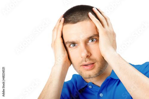 Photo: Puzzled man, isolated on white Puzzled man, isolated on white