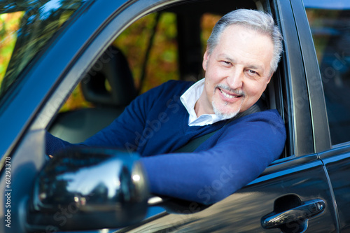 Photo: Senior driving his car Senior driving his car