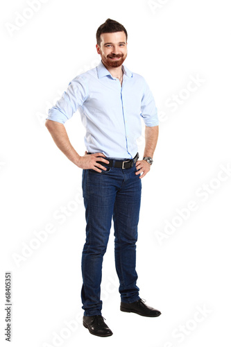 Photo: Handsome casual man smiling - isolated over a white background Handsome casual man smiling - isolated over a white background