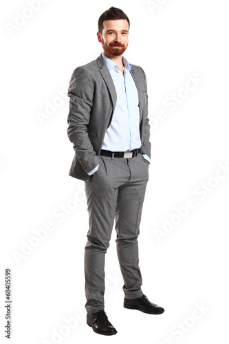 Photo: Handsome casual man smiling - isolated over a white background Handsome casual man smiling - isolated over a white background