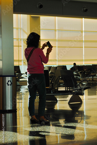Photo: Woman Using Cell Phone Woman Using Cell Phone