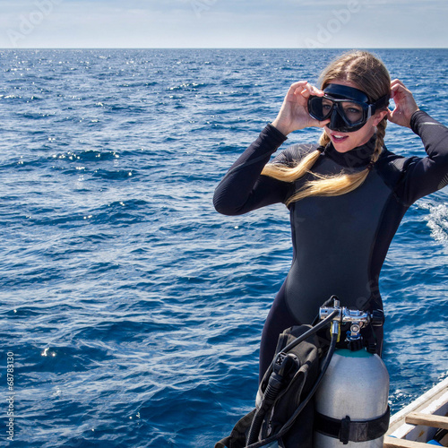 Photo: Beautiful Caucasian Woman Getting Ready for Scuba Diving Beautiful Caucasian Woman Getting Ready for Scuba Diving