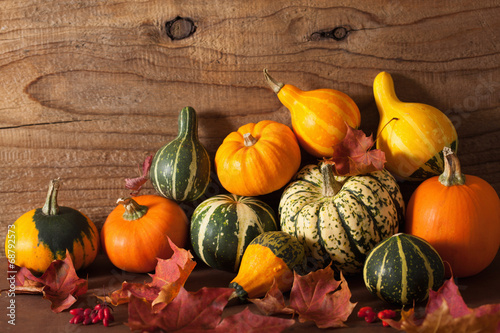 Photo: decorative mini pumpkins on wooden background decorative mini pumpkins on wooden background