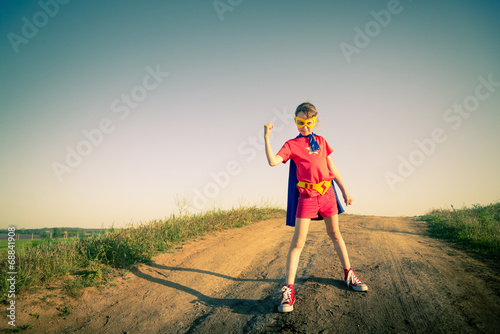 Photo: child acting like a super hero child acting like a super hero