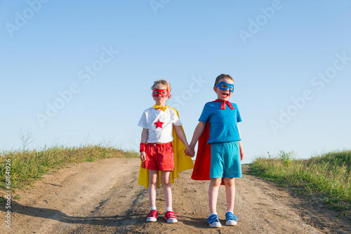 Photo: children acting like a superhero children acting like a superhero