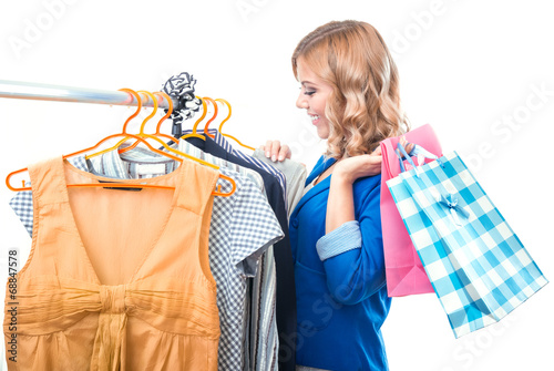 Photo: Happy woman in boutigue with shopping bags Happy woman in boutigue with shopping bags