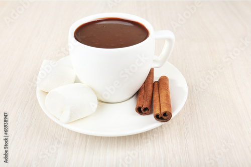 Photo: Cup of hot chocolate on table, close up Cup of hot chocolate on table, close up