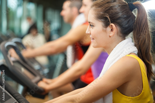 Photo: Woman training in a fitness club Woman training in a fitness club