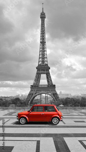  Eiffel tower with car. Black and white photo with red element.