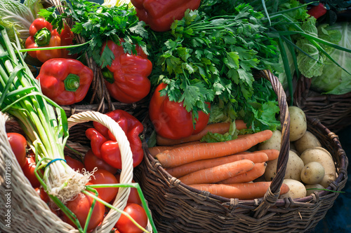 Photo: variety of vegetables in baskets variety of vegetables in baskets