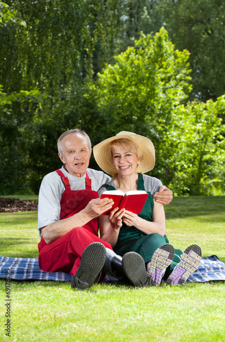 Photo: Married couple resting in garden Married couple resting in garden