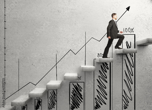Photo: businessman climbing businessman climbing