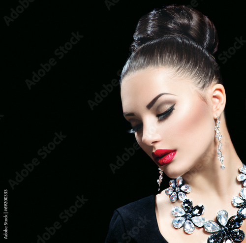 Photo: Beauty woman with perfect makeup and luxury accessories Beauty woman with perfect makeup and luxury accessories