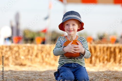 Photo: kid at pumpkin patch kid at pumpkin patch