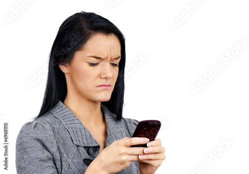 Unhappy woman with phone - 69681115