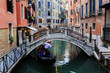 Venice, Italy - Gondolier and historic tenements Venice, Italy - Gondolier and historic tenements