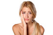 beautiful young blonde with a toothache on white background
