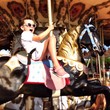 child on carousel child on carousel