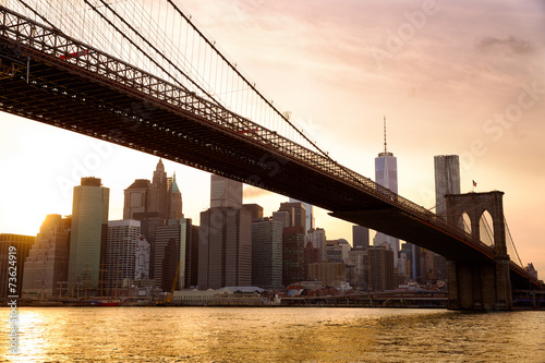 Fototapeta Manhattan skyline with Brooklyn Bridge at sunset, New York City