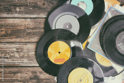 Naklejka dekoracyjna close up image of old records over wooden background , image is