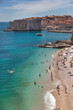 People on Banje beach with Old town in background People on Banje beach with Old town in background