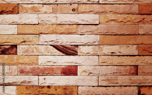 vintage color tone modern stone wall for background, warm tone
