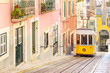 Traditional yellow trams on a street in Lisbon, Portugal Traditional yellow trams on a street in Lisbon, Portugal
