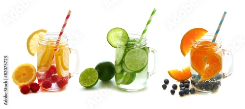 Healthy detox water with fruit in mason jars isolated