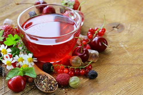 berry tea with fresh currants, raspberries and strawberries