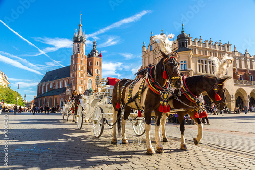 Obraz Fotograficzny Horse carriages at main square in Krakow